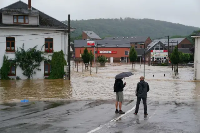 Resident survey the damage in Liege after heavy flooding