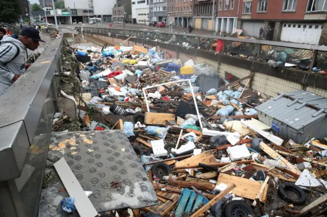 Wreckage lies on the river, following heavy rainfalls in Verviers