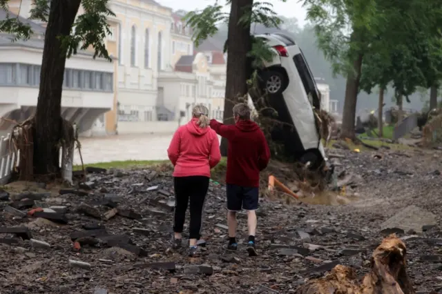 Residents stand amid the debris in Bad Neuenahr-Ahrweiler, Germany. Photo: 16 July 2021