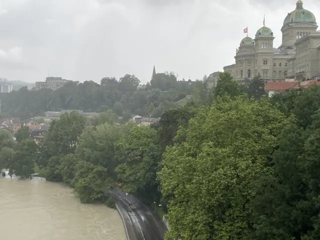 Swollen river Aare near the Swiss parliament building in Bern