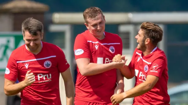 Dylan Mackin celebrates with team-mates after putting Stirling ahead away to Inverness