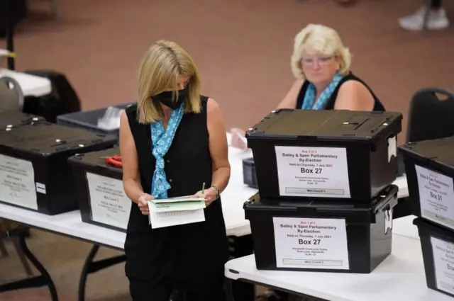 Ballot counters counting the by-election votes