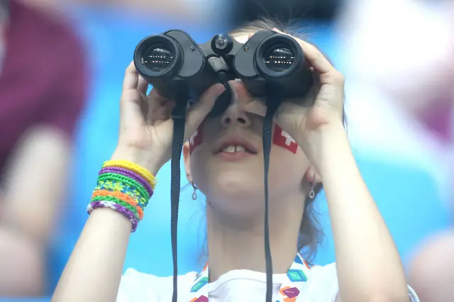 Fan with binoculars in the stadium