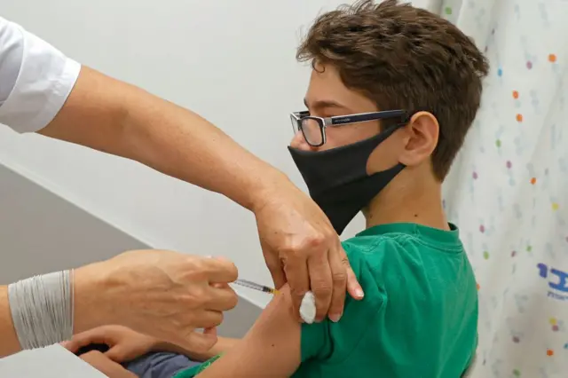 teenager being vaccinated