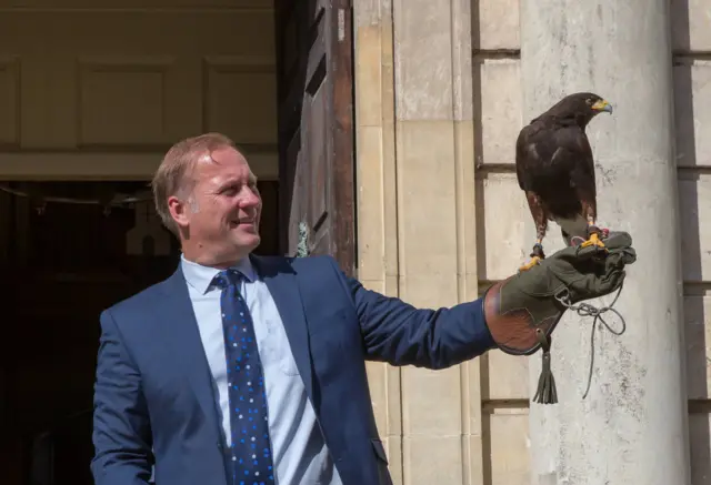 Councillor Marc Bayliss with a harris hawk