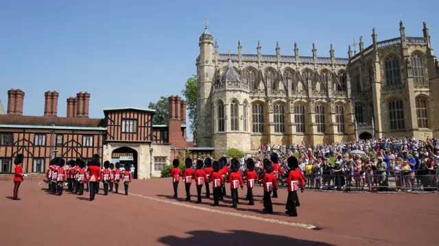 Members of the 1st battalion Grenadier Guards take part in the Changing of the Guard at Windsor Castle in Berkshire, which is taking place for the first time since the start of the coronavirus pandemic. Picture date: Thursday July 22, 2021.