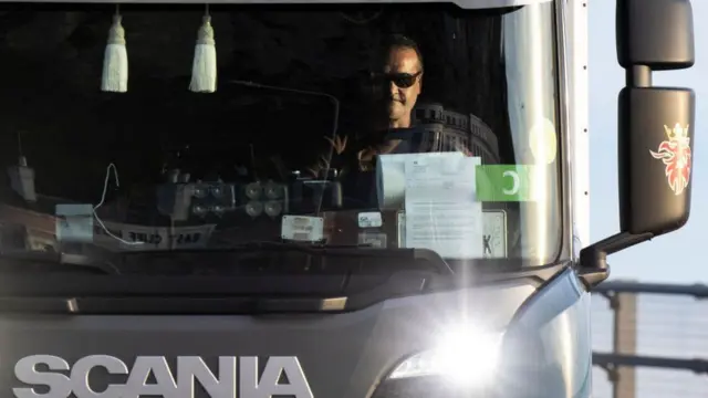 A lorry driver in his cab