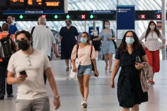 Rail passengers wear facemasks