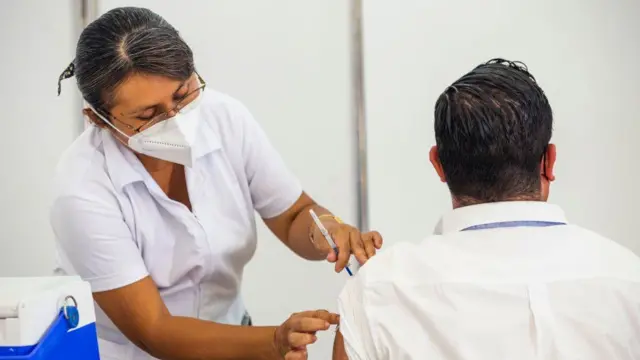 Health worker gives a vaccination