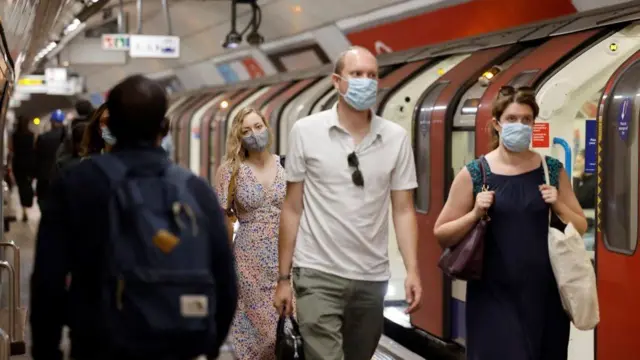 People wearing masks on London tube