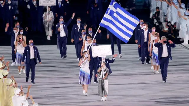 Greece enter the stadium
