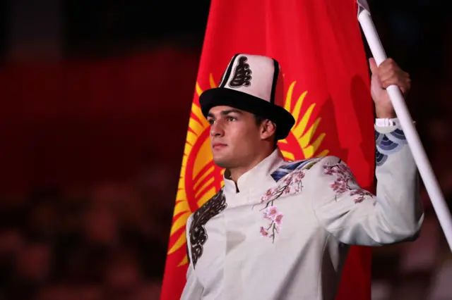 Kyrgyzstan's flagbearer Denis Petrashov