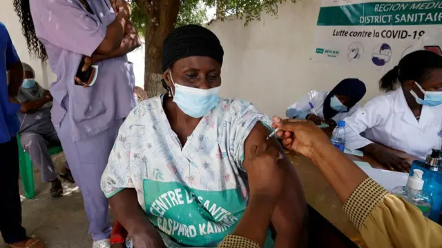 A health worker receives a dose of coronavirus disease (COVID-19) vaccine in Dakar, Senegal