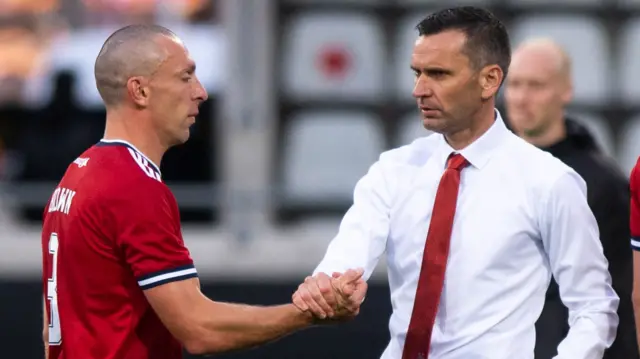 Manager Stephen Glass and captain Scott Brown at full-time