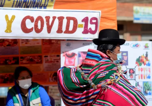 People wearing face masks in Peru