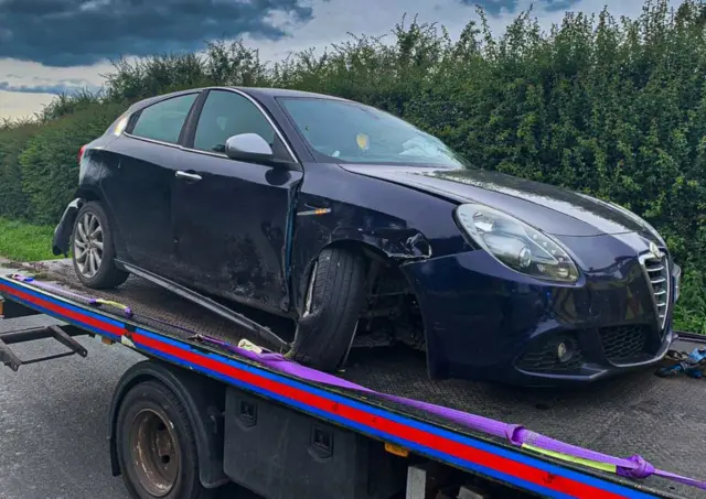 Crashed car on truck