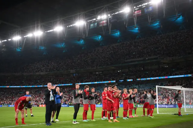 Denmark applaud their fans after their loss against England