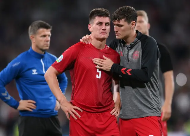 Andreas Christensen consoling Joakim Maehle