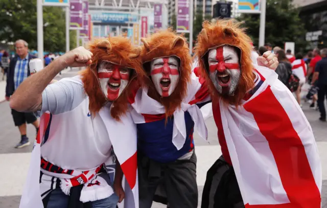 England fans dressed as Three Lions