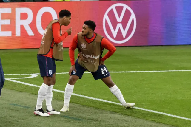 Jude Bellingham and Reece James talk on the sideline