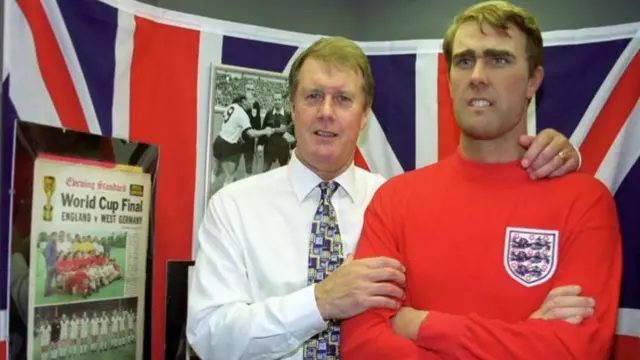 Sir Geoff Hurst stands next to his waxwork at the Premier League Hall of Fame in 1999