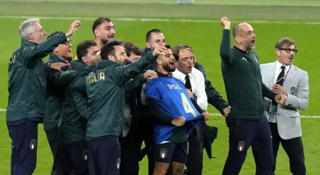 Lorenzo Insigne wears a Leonardo Spinazzola shirt to pay tribute to his injured team-mate after Italy's win over Spain