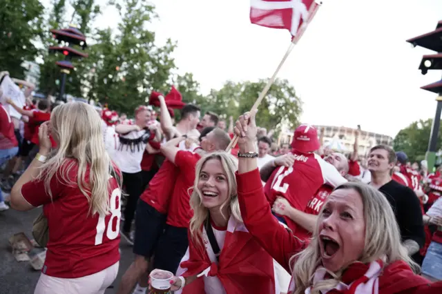 Denmark fans celebrate the opener