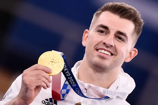 Max Whitlock holds his gold medal