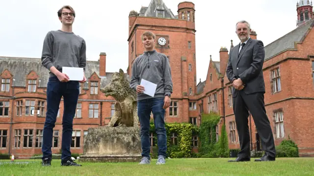 Ben Coulter (left) and Head Prefect George Robinson with Headmaster Robert Robinson (right) at Campbell College in Belfast