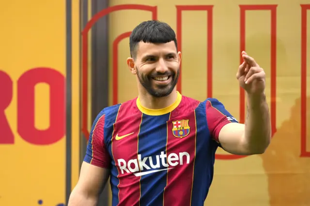 Sergio Aguero poses in a Barcelona shirt