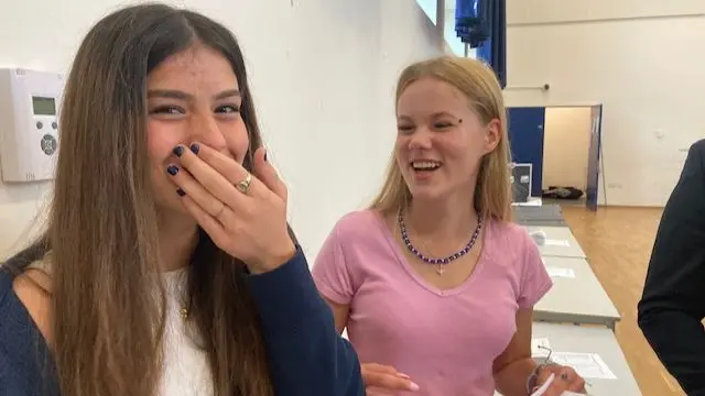 Georgia (l) and Elisabeth receiving their results