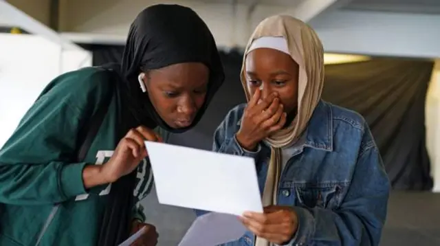 Pupils at City Academy in Birmingham receiving their grades this morning