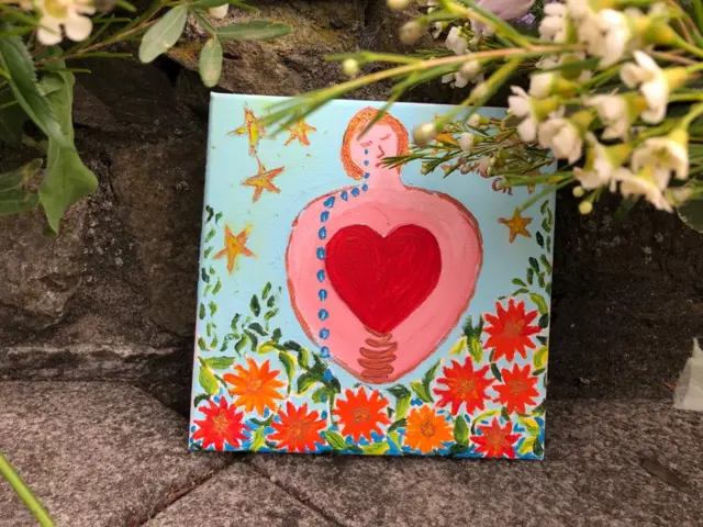 Card with drawing of crying woman and love heart