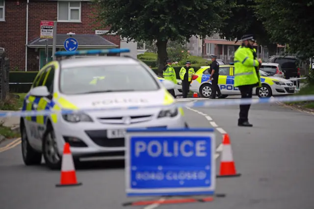 Officers near a police cordon