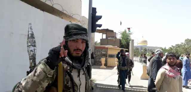 Taliban militants patrol after taking control of the Governor"s house and Ghazni city, in Afghanistan,