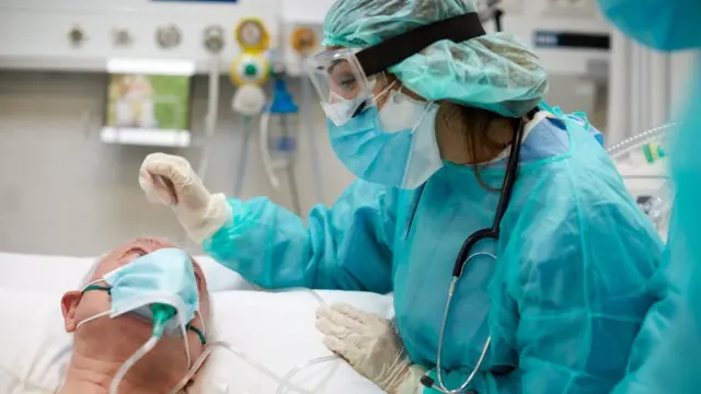 Health worker treating a patient