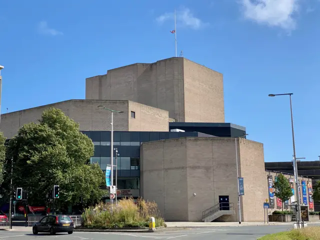 Theatre Royal in Plymouth flying Union Flag at half mast