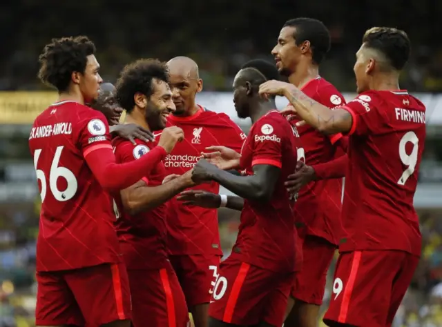 Liverpool players celebrate Mohamed Salah's goal against Norwich