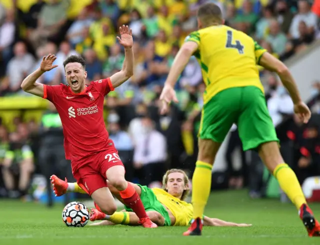 Todd Cantwell fouls Diogo Jota