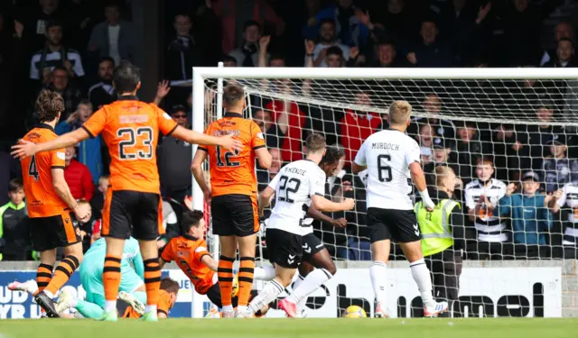 Tomi Adeloye (partially hidden) scores to make it 1-0 Ayr United