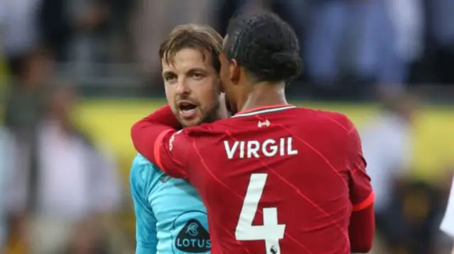 Tim Krul is embraced by Virgil van Dijk