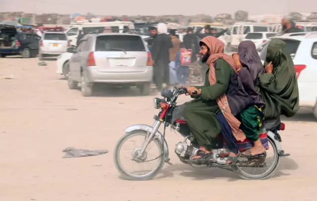 Afghan man and women on a motorcyle