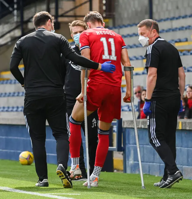 Ryan Hedges left on crutches