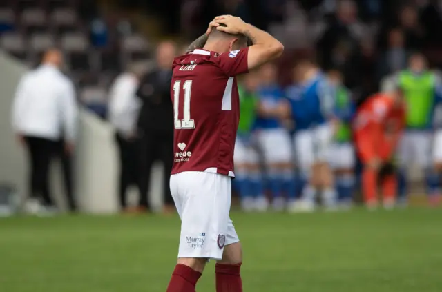 Arbroath's Bobby Linn is dejected after missing his penalty