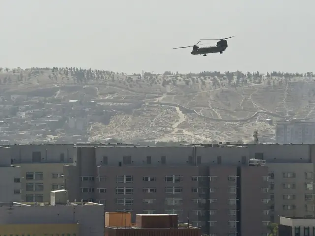 A US Chinook helicopter flies over the US embassy in Kabul.