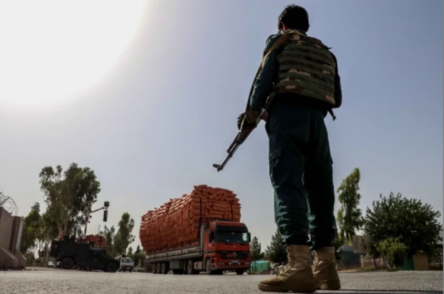 An Afghan security official at a check point in Kandahar on 12 August