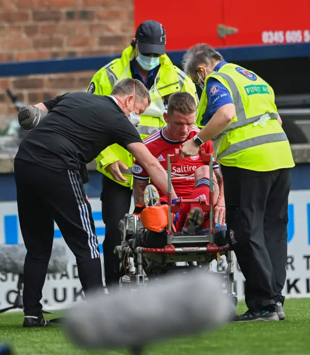 Jonny Hayes was helped off on a stretcher