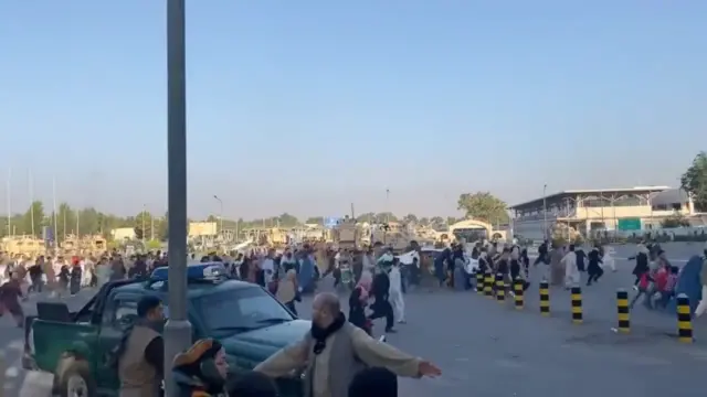 People run towards Kabul international airport