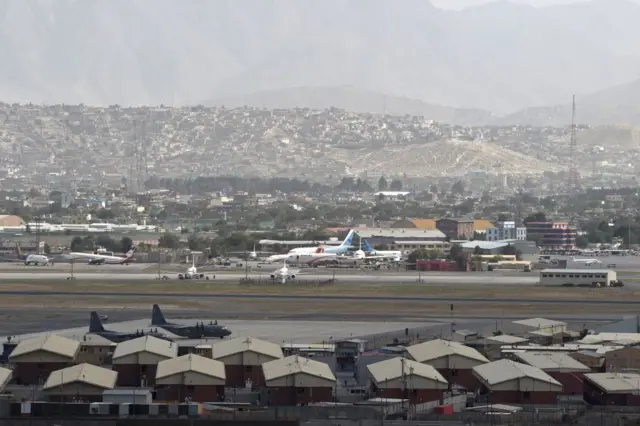 his picture taken on August 14, 2021 shows aircrafts standing on the tarmac of the airport in Kabul.