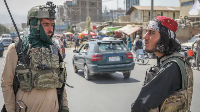 Taliban stand in a checkpoint in Kabul, Afghanistan, 16 August 2021